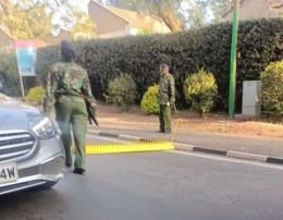 Police lay roadblocks in one of the roads leading to State House.